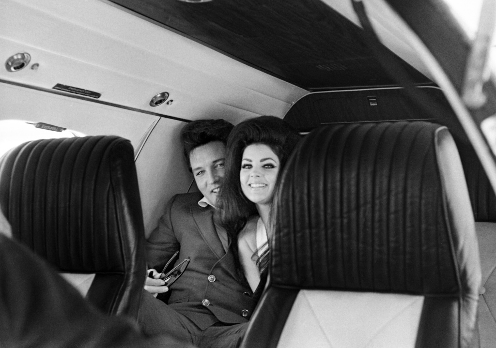 singer-elvis-presley-peeks-out-from-behind-his-wife-news-photo-1655143210.jpg